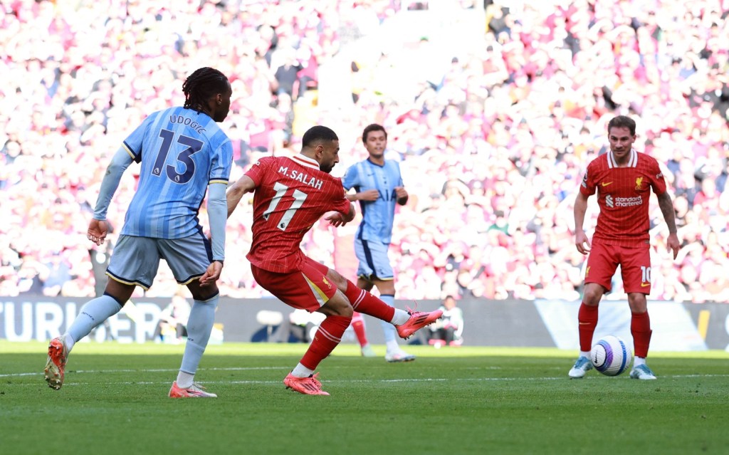 April 27, 2025; Anfield, Liverpool, BRITAIN; Liverpool player Mohamed Salah scores the fourth goal against the Tottenham Hotspur in a Premier League match.