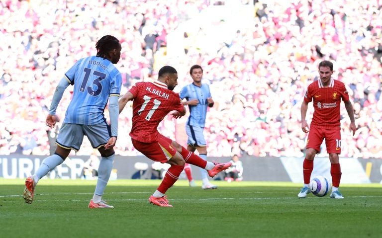 April 27, 2025; Anfield, Liverpool, BRITAIN; Liverpool player Mohamed Salah scores the fourth goal against the Tottenham Hotspur in a Premier League match.