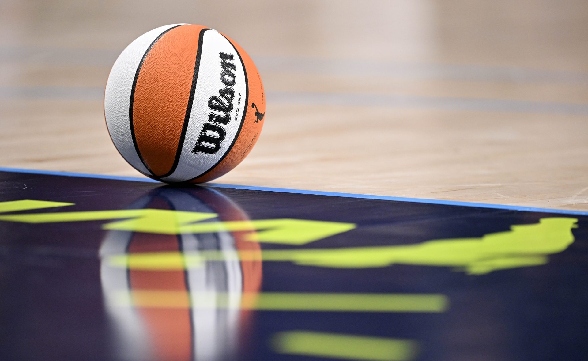 Jun 27, 2025; Dallas, Texas, USA; A view of a Wilson basketball and the Dallas Wings logo during the game between the Wings and the Indiana Fever at the American Airlines Center.