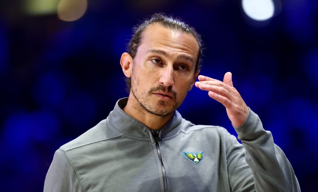 Aug 24, 2025; Arlington, Texas, USA; Dallas Wings head coach Chris Koclanes reacts against the Golden State Valkyries during the first half at College Park Center