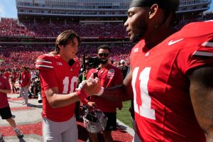 Ohio State Buckeyes quarterback Julian Sayin (10) and linebacker C.J. Hicks (11) shake hands while leaving the field following the NCAA football game at Ohio Stadium on Aug. 30, 2025. Ohio State won 14-7
