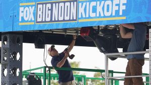 Workers set up the stages for the “Fox Big Noon Kickoff” sports show live telecast before Saturday’s Iowa State and Iowa football game at Jack Trice Stadium in Ames, Iowa.