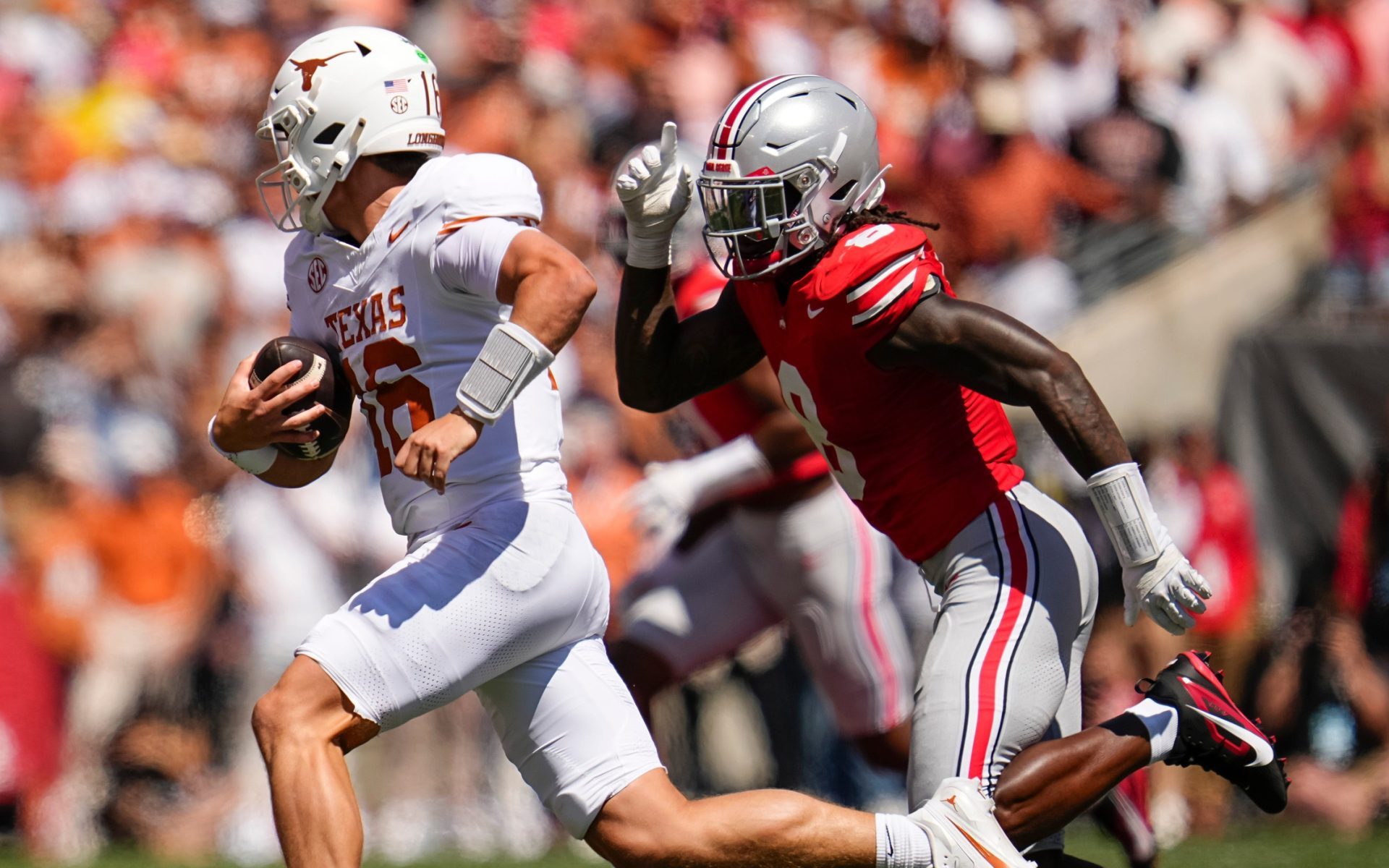 Ohio State Buckeyes linebacker Arvell Reese (8) pursues Texas Longhorns quarterback Arch Manning (16) during the NCAA football game at Ohio Stadium on Aug. 30, 2025.