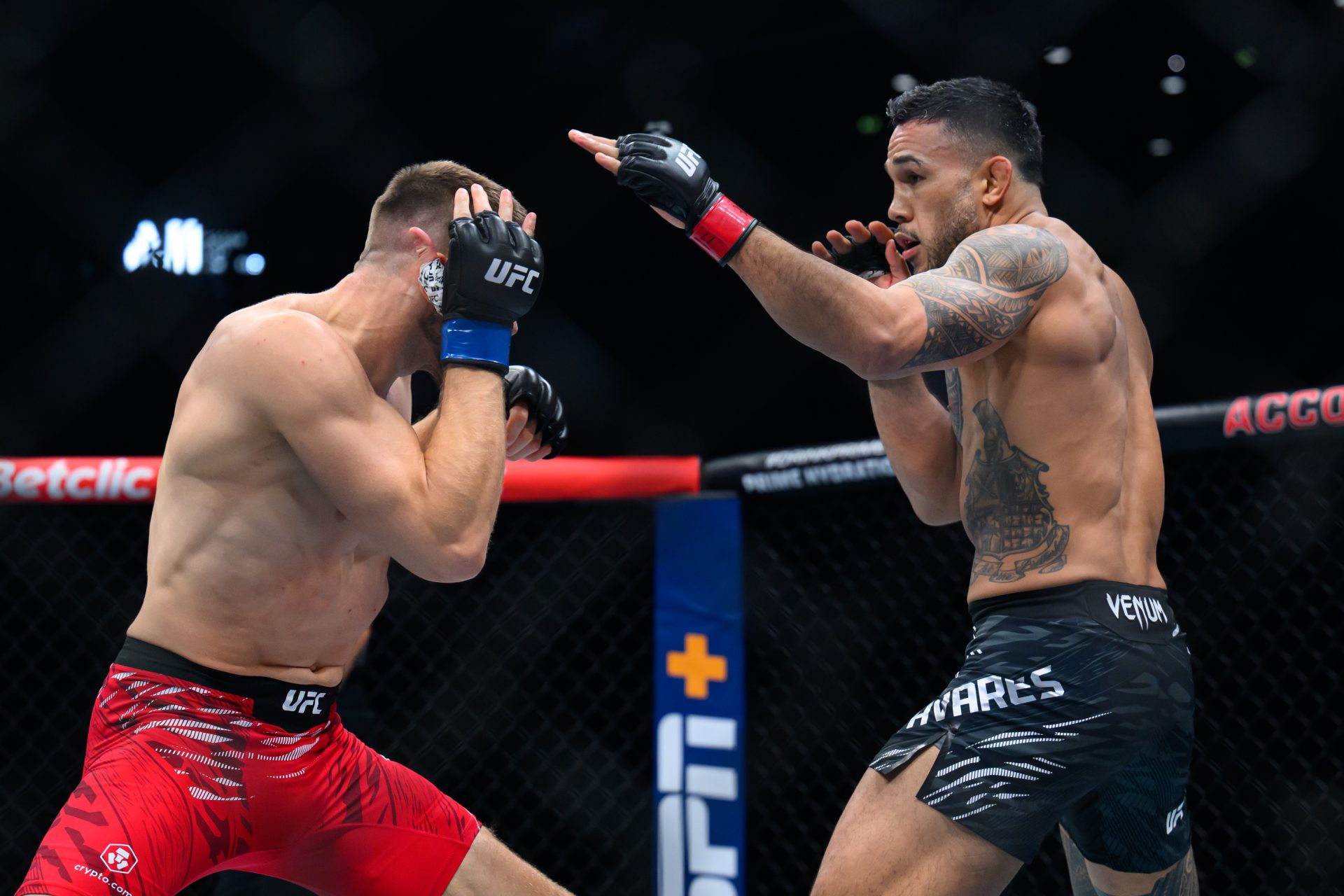 Sep 6, 2025; Paris, FRANCE; Brad Tavares (red gloves) fights Robert Bryczek (blue gloves) during UFC Fight Night at Accor Arena.