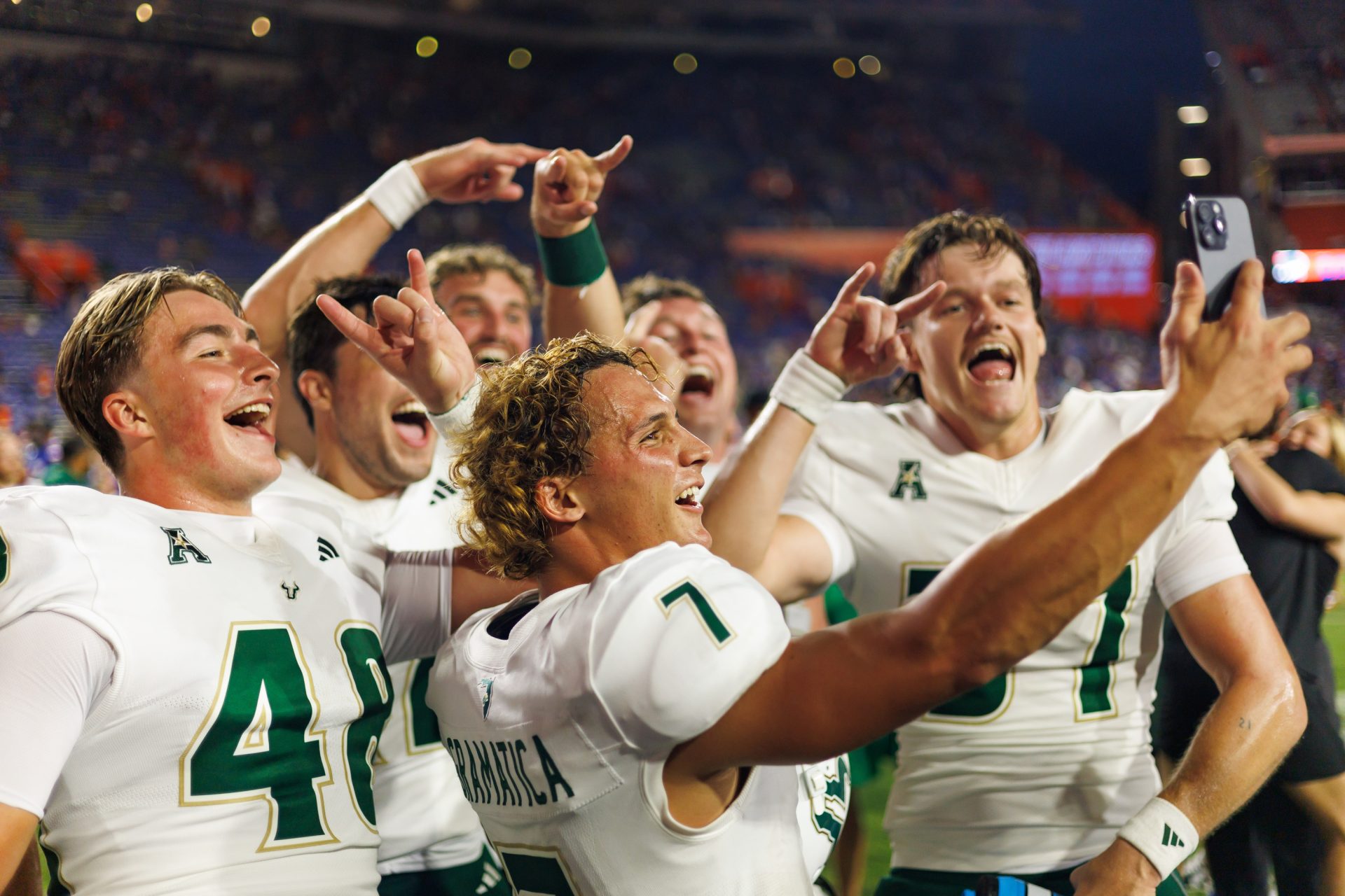 Sep 6, 2025; Gainesville, Florida, USA; South Florida Bulls place kicker Nico Gramatica (7), South Florida Bulls long snapper Turner McLaughlin (48) and teammates celebrate after a game against the Florida Gators at Ben Hill Griffin Stadium.