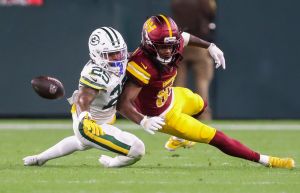 Green Bay Packers cornerback Keisean Nixon (25) breaks up a pass intended for Washington Commanders wide receiver Noah Brown (85) on Thursday, September 11, 2025, at Lambeau Field in Green Bay, Wis. The Packers won the game, 27-18.