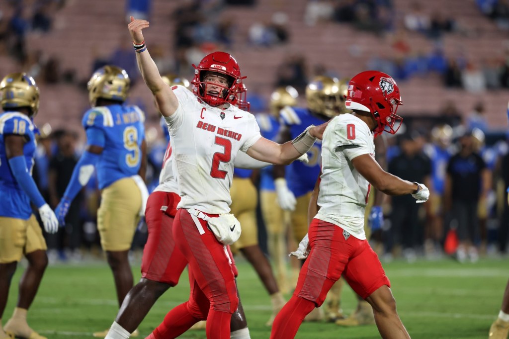 Sep 12, 2025; Pasadena, California, USA; New Mexico Lobos quarterback Jack Layne (2) reacts after his team scored a touchdown during the fourth quarter against the UCLA Bruins at Rose Bowl.