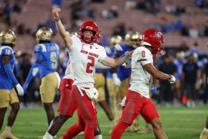 Sep 12, 2025; Pasadena, California, USA; New Mexico Lobos quarterback Jack Layne (2) reacts after his team scored a touchdown during the fourth quarter against the UCLA Bruins at Rose Bowl.