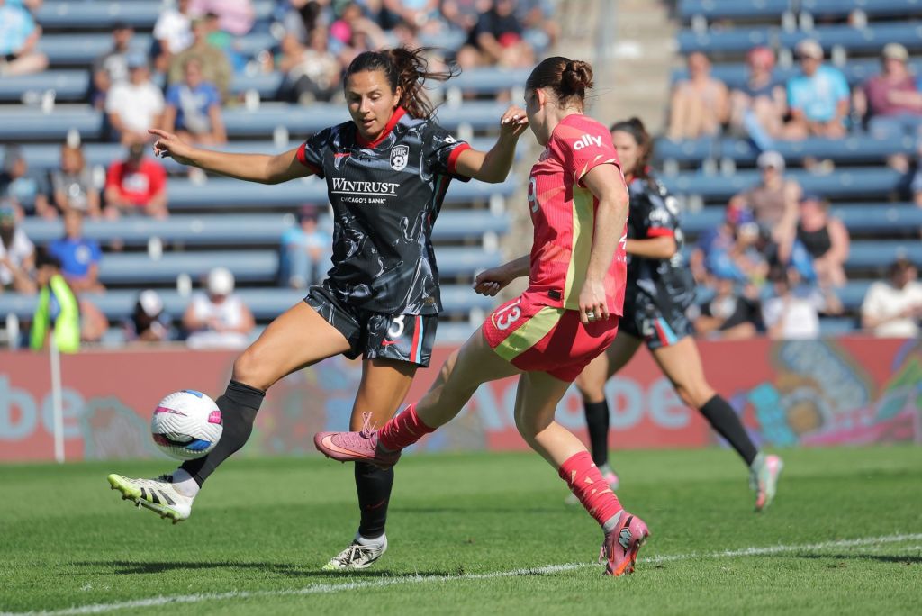 Sep 14, 2025; Bridgeview, Illinois, USA; Portland Thorns FC midfielder Olivia Moultrie (13) kicks the ball past Chicago Stars FC defender Sam Staab (3) during the second half of a match at SeatGeek Stadium.