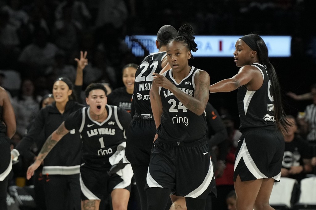 Sep 14, 2025; Las Vegas, Nevada, USA; Las Vegas Aces guard Jewell Loyd (24) gestures to a teammate after scoring against the Seattle Storm in the first quarter during game one of round one for the 2025 WNBA Playoffs at Michelob Ultra Arena.