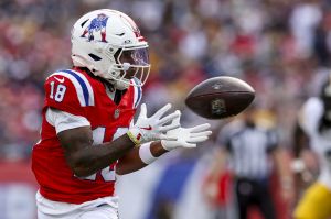 Sep 21, 2025; Foxborough, Massachusetts, USA; New England Patriots wide receiver Kyle Williams (18) completes a pass during the third quarter at Gillette Stadium.