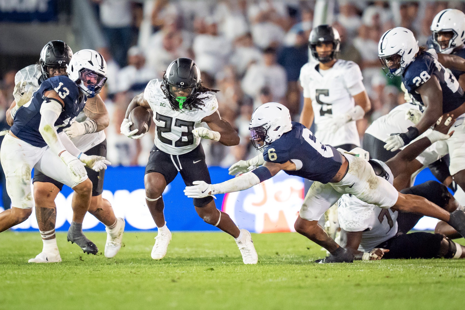 Oregon running back Dierre Hill Jr. picks up yards for the Ducks as the Oregon Ducks face the Penn State Nittany Lions on Sept. 27, 2025, at Beaver Stadium in University Park, Pennsylvania.