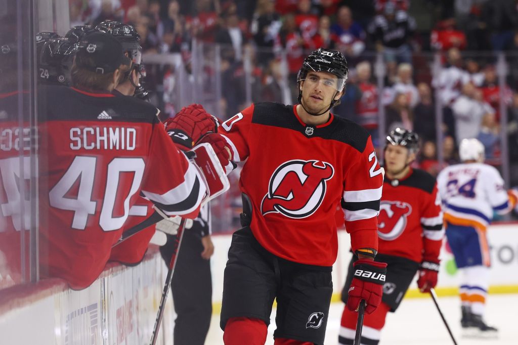 Nov 28, 2023; Newark, New Jersey, USA; New Jersey Devils center Michael McLeod (20) celebrates his goal against the New York Islanders during the first period at Prudential Center. Mandatory Credit: