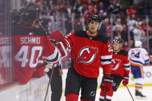 Nov 28, 2023; Newark, New Jersey, USA; New Jersey Devils center Michael McLeod (20) celebrates his goal against the New York Islanders during the first period at Prudential Center. Mandatory Credit: