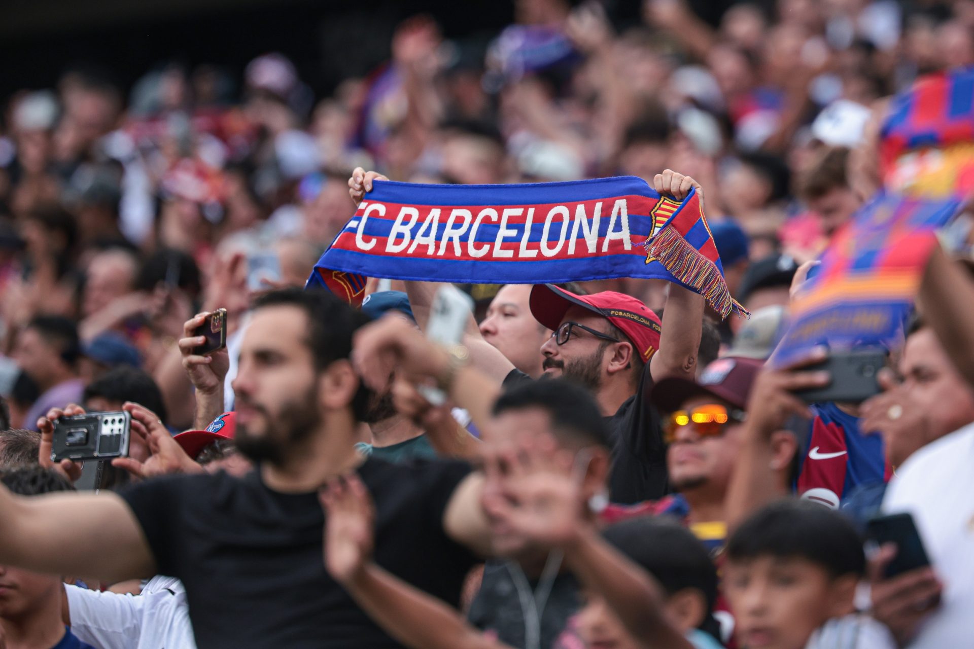 Aug 3, 2024; East Rutherford, NJ, USA; A Barcelona fan before holds a scarf before the international friendly against Real Madrid at MetLife Stadium.