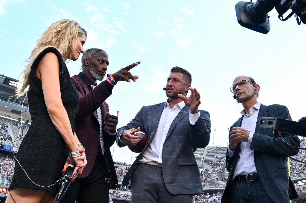 Oct 5, 2024; College Station, Texas, USA; SEC Nation host Laura Rutledge, analyst Roman Harper, analyst Tim Tebow and analyst Paul Finebaum speak prior to the game between the Texas A&M Aggies and the Missouri Tigers at Kyle Field.