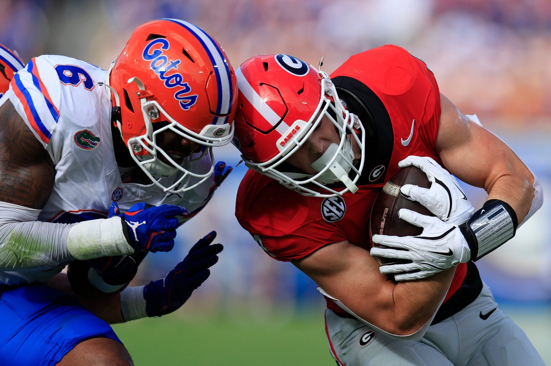 Florida Gators linebacker Shemar James (6) tackles Georgia Bulldogs tight end Oscar Delp (4) during the first quarter of an NCAA college football matchup Saturday, Nov. 2, 2024 at EverBank Stadium in Jacksonville, Fla. The Georgia Bulldogs defeated the Florida Gators 34-20.