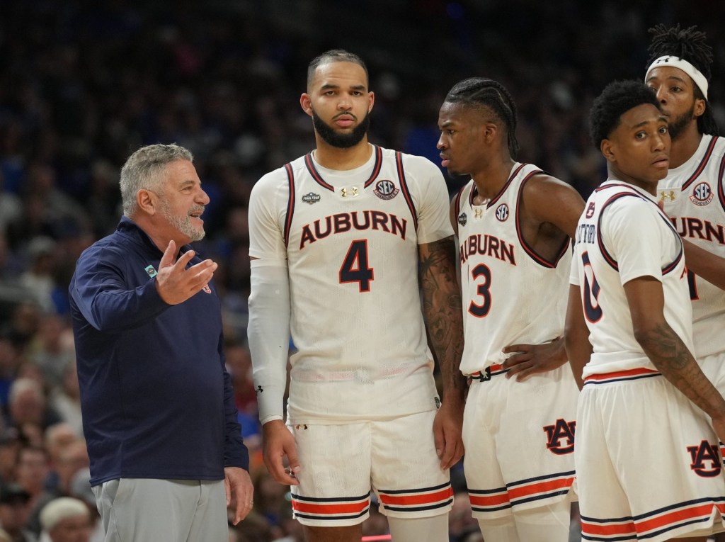 Apr 5, 2025; San Antonio, TX, USA; Auburn Tigers head coach Bruce Pearl talks with his players against the Florida Gators in the semifinals of the men's Final Four of the 2025 NCAA Tournament at the Alamodome.