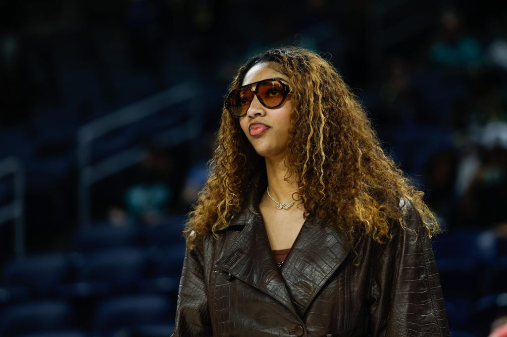 Sep 11, 2025; Chicago, Illinois, USA; Injured Chicago Sky forward Angel Reese (5) stands on the sidelines before a WNBA game against the New York Liberty at Wintrust Arena.