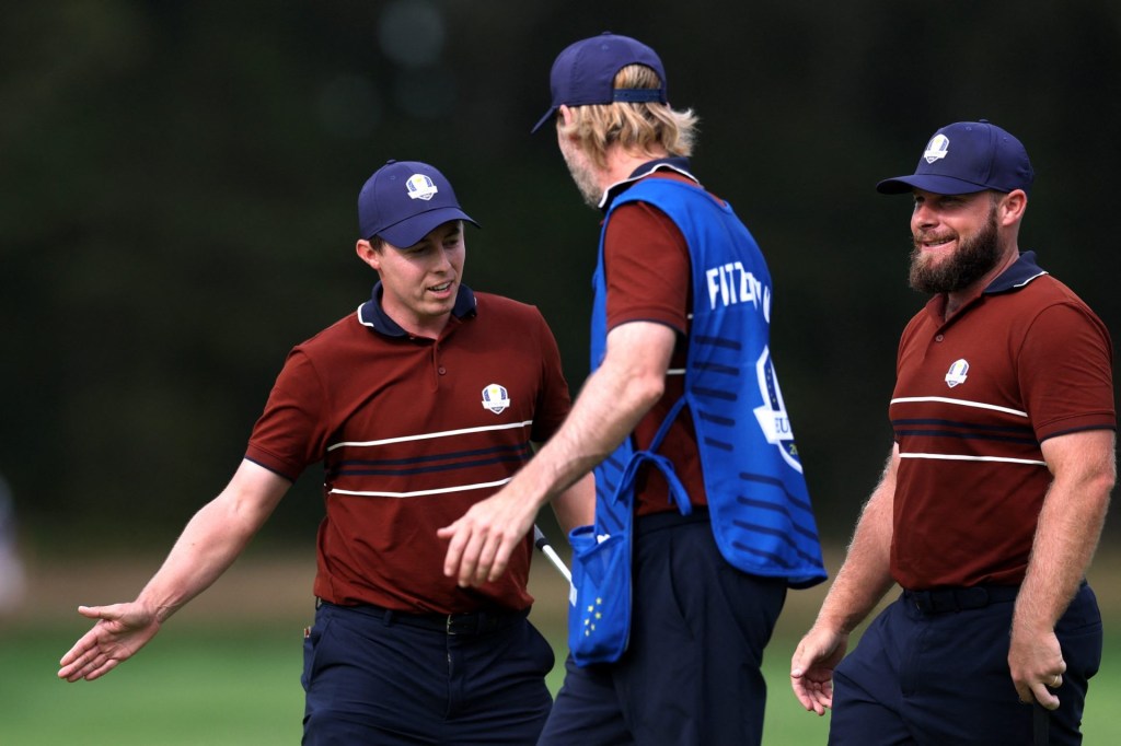[US, Mexico & Canada customers only] Sep 27, 2025; Bethpage, New York, USA; Team Europe's Matt Fitzpatrick celebrates with Tyrrell Hatton after holing his putt to win the hole on the 9th hole during the four-balls on the second day of competition for the Ryder Cup at Bethpage Black.