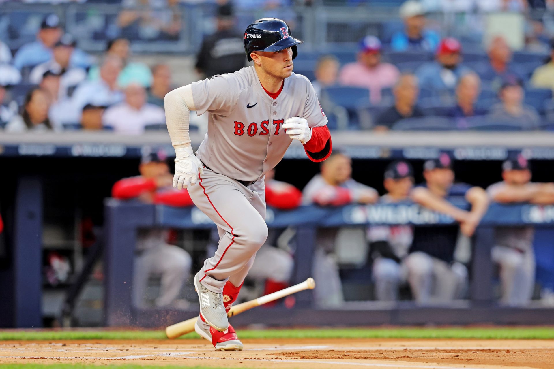 Sep 30, 2025; Bronx, New York, USA; Boston Red Sox third base Alex Bregman (2) hits a single during the first inning against the New York Yankees during game one of the Wildcard round for the 2025 MLB playoffs at Yankee Stadium.