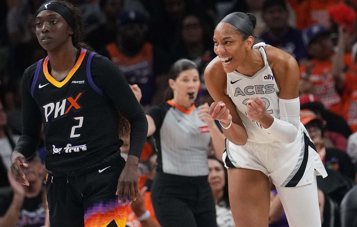 Las Vegas Aces center A'ja Wilson (22) celebrates a made shot as Phoenix Mercury guard Kahleah Copper (2) looks on during Game 3 of the WNBA Finals at Mortgage Matchup Center on Wednesday, Oct. 8, 2025.