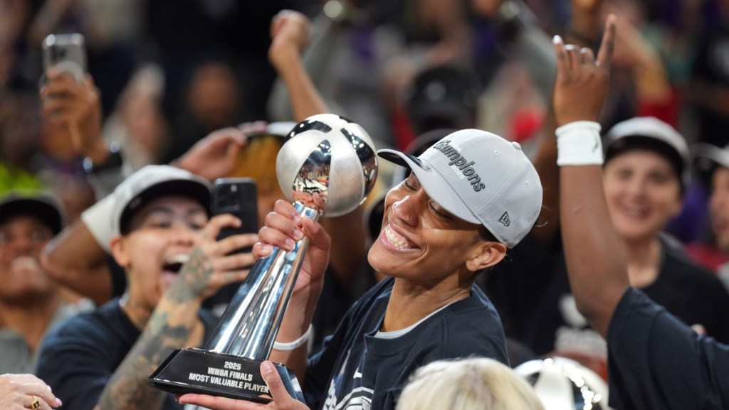 Oct 10, 2025; Phoenix, Arizona, USA; Las Vegas Aces center A'ja Wilson (22) celebrates with teammates after game four of the 2025 WNBA Finals at Mortgage Matchup Center.