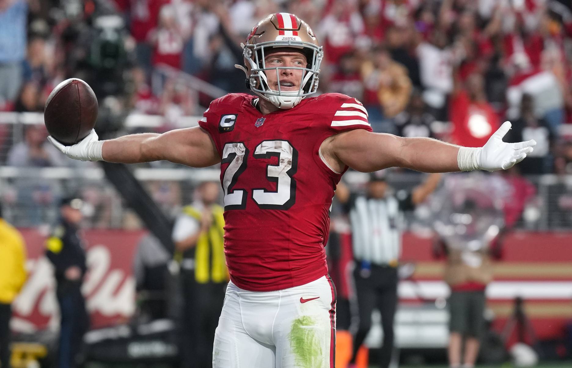 Oct 19, 2025; Santa Clara, California, USA; San Francisco 49ers running back Christian McCaffrey (23) celebrates after a touchdown during the second quarter against the Atlanta Falcons at Levi's Stadium.