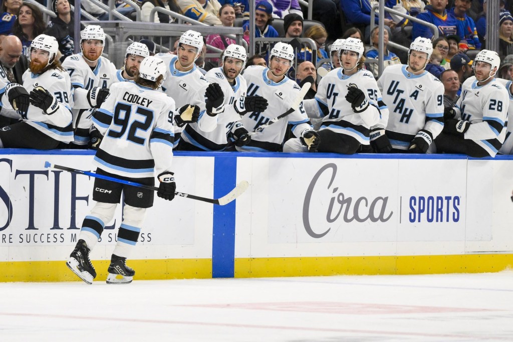Oct 23, 2025; St. Louis, Missouri, USA; Utah Mammoth center Logan Cooley (92) is congratulated by teammates after scoring against the St. Louis Blues during the first period at Enterprise Center