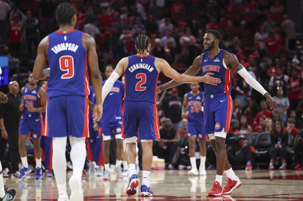 Oct 24, 2025; Houston, Texas, USA; Detroit Pistons forward Paul Reed (7) celebrates with guard Cade Cunningham (2) after a play during the fourth quarter against the Houston Rockets at Toyota Center.