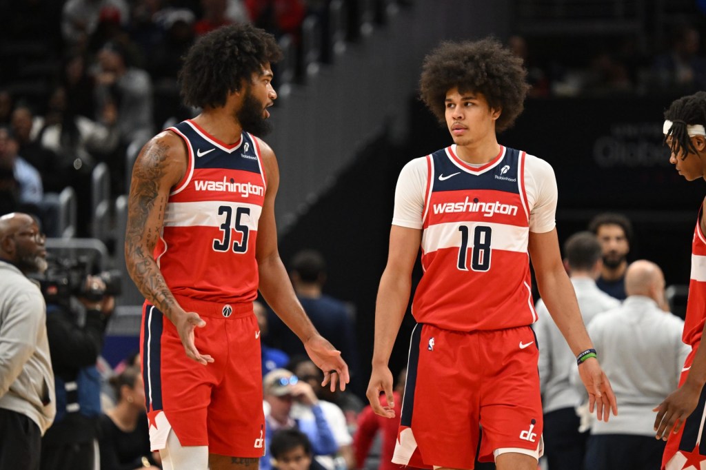 Oct 26, 2025; Washington, District of Columbia, USA; Washington Wizards forward Marvin Bagley III (35) and forward Kyshawn George (18) talk after a turnover against the Charlotte Hornets during the third quarter at Capital One Arena.