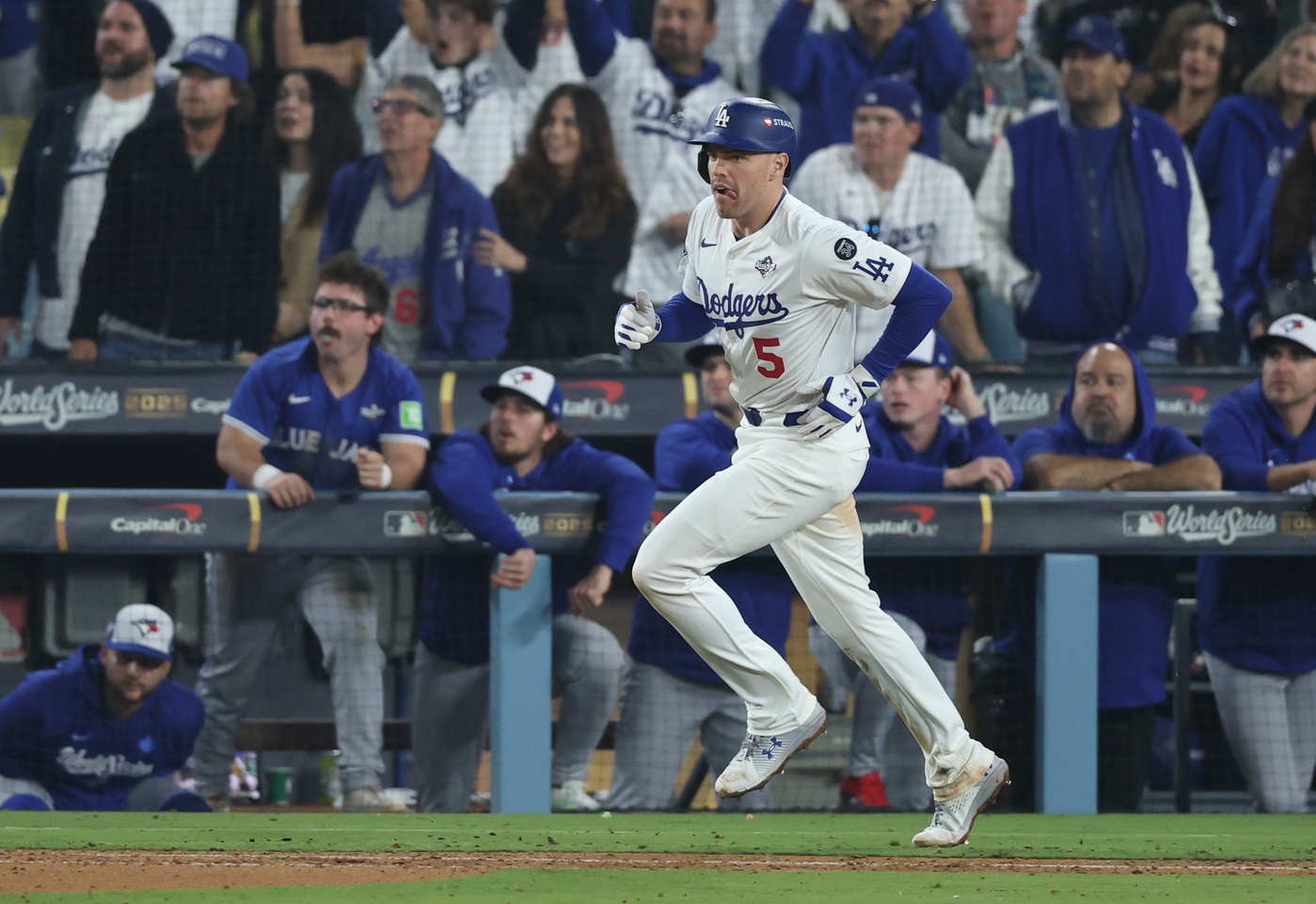 Oct 27, 2025; Los Angeles, California, USA; Los Angeles Dodgers first baseman Freddie Freeman (5) hits a game-winning home run in the eighteenth inning against the Toronto Blue Jays in game three of the 2025 MLB World Series at Dodger Stadium.