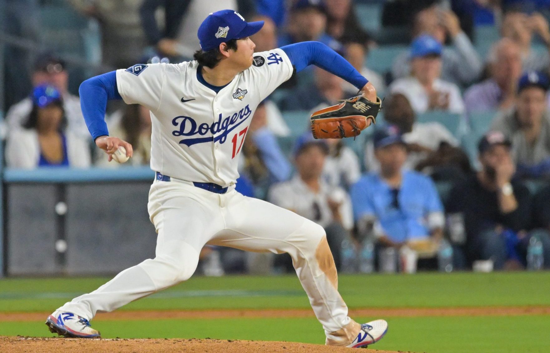 Oct 28, 2025; Los Angeles, California, USA; Los Angeles Dodgers two-way player Shohei Ohtani (17) pitches during the fifth inning against the Toronto Blue Jays during game four of the 2025 MLB World Series at Dodger Stadium.