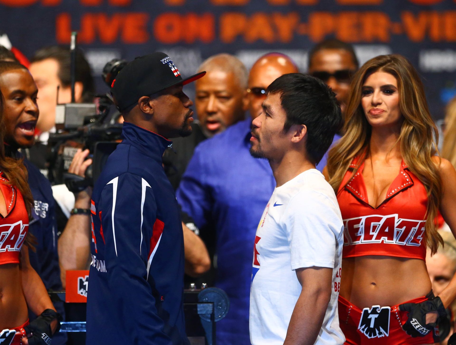 May 1, 2015; Las Vegas, NV, USA; Floyd Mayweather (left) stares at Manny Pacquiao during weigh-ins for the upcoming boxing fight at MGM Grand Garden Arena.