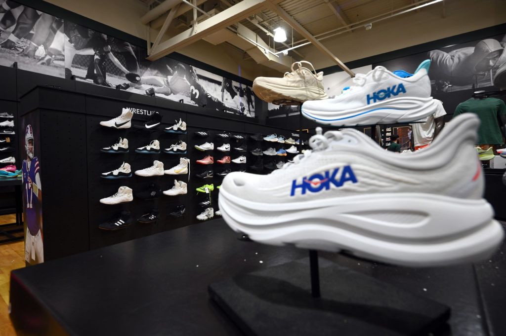 Hoka Sneakers of various brands on display at a Dick's Sporting Goods retail store, New York, NY, August 4, 2025. China, Vietnam and Indonesia are the top countries where shoes are manufactured and tariffs of a minimum of 19% for these three countries goes into effect next week.