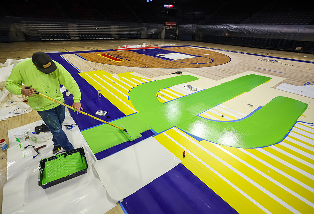 TUCSON, ARIZ. -- Resurfacing and painting of the new floor at McKale Center.