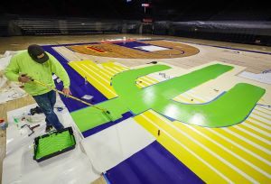 TUCSON, ARIZ. -- Resurfacing and painting of the new floor at McKale Center.