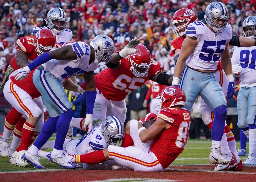 Nov 21, 2021; Kansas City, Missouri, USA; Kansas City Chiefs tight end Travis Kelce (87) scores against the Dallas Cowboys during the first half at GEHA Field at Arrowhead Stadium.