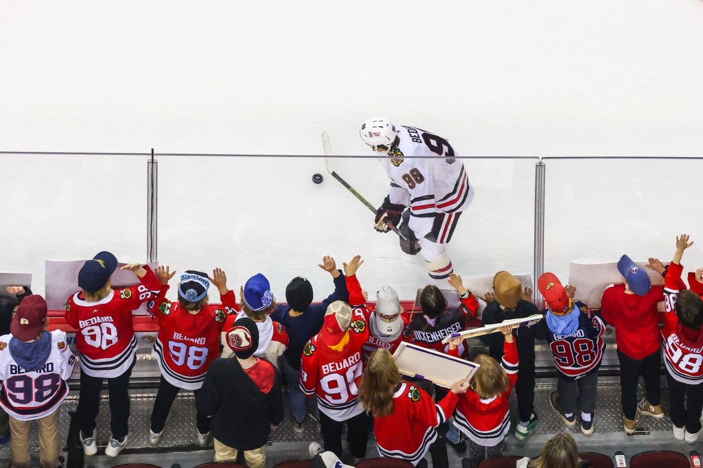 Dec 21, 2024; Calgary, Alberta, CAN; Chicago Blackhawks center Connor Bedard (98) skates with the puck in front of his fans during the warmup period against the Calgary Flames at Scotiabank Saddledome.