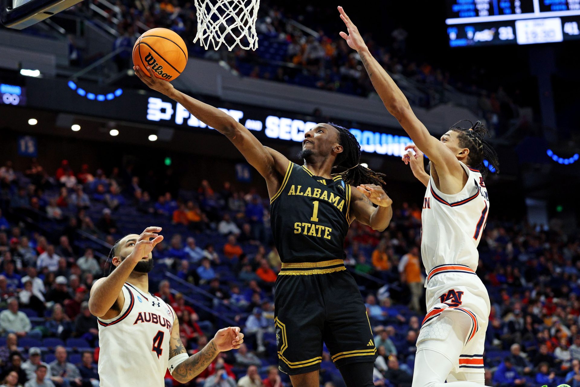 Mar 20, 2025; Lexington, KY, USA; Alabama State Hornets guard Amarr Knox (1) shoots the ball against Auburn Tigers forward Johni Broome (4) during the second half in the first round of the NCAA Tournament at Rupp Arena.