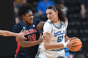 Mar 28, 2025; Spokane, WA, USA; UCLA Bruins center Lauren Betts (51) fights for position against Ole Miss Rebels forward Christeen Iwuala (12). during the first half of a Sweet 16 NCAA Tournament basketball game at Spokane Arena. at Spokane Arena.