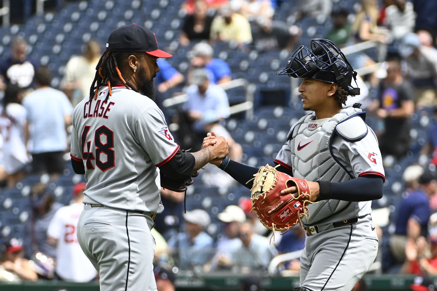 May 7, 2025; Washington, District of Columbia, USA; Cleveland Guardians relief pitcher Emmanuel Clase (48) is congratulated by catcher Bo Naylor (23) after earning a save against the Washington Nationals at Nationals Park.