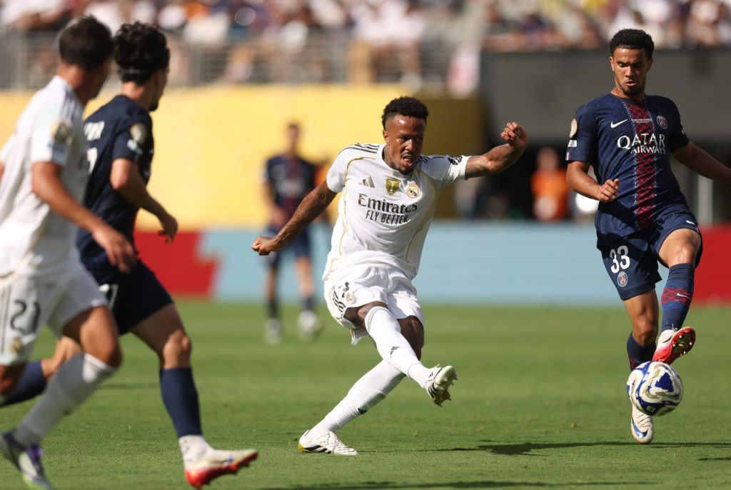 Jul 9, 2025; East Rutherford, New Jersey, USA; Real Madrid CF defender Eder Militao (3) in action with Paris Saint-Germain midfielder Warren Zaire-Emery (33) during a semifinal match of the 2025 FIFA Club World Cup at MetLife Stadium.