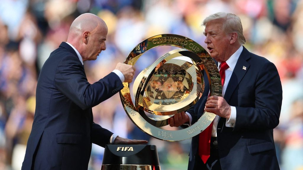 Jul 13, 2025; East Rutherford, New Jersey, USA; FIFA president Gianni Infantino and President Donald Trump carry the FIFA Club World Cup trophy during the presentation after the final of the 2025 FIFA Club World Cup at MetLife Stadium.