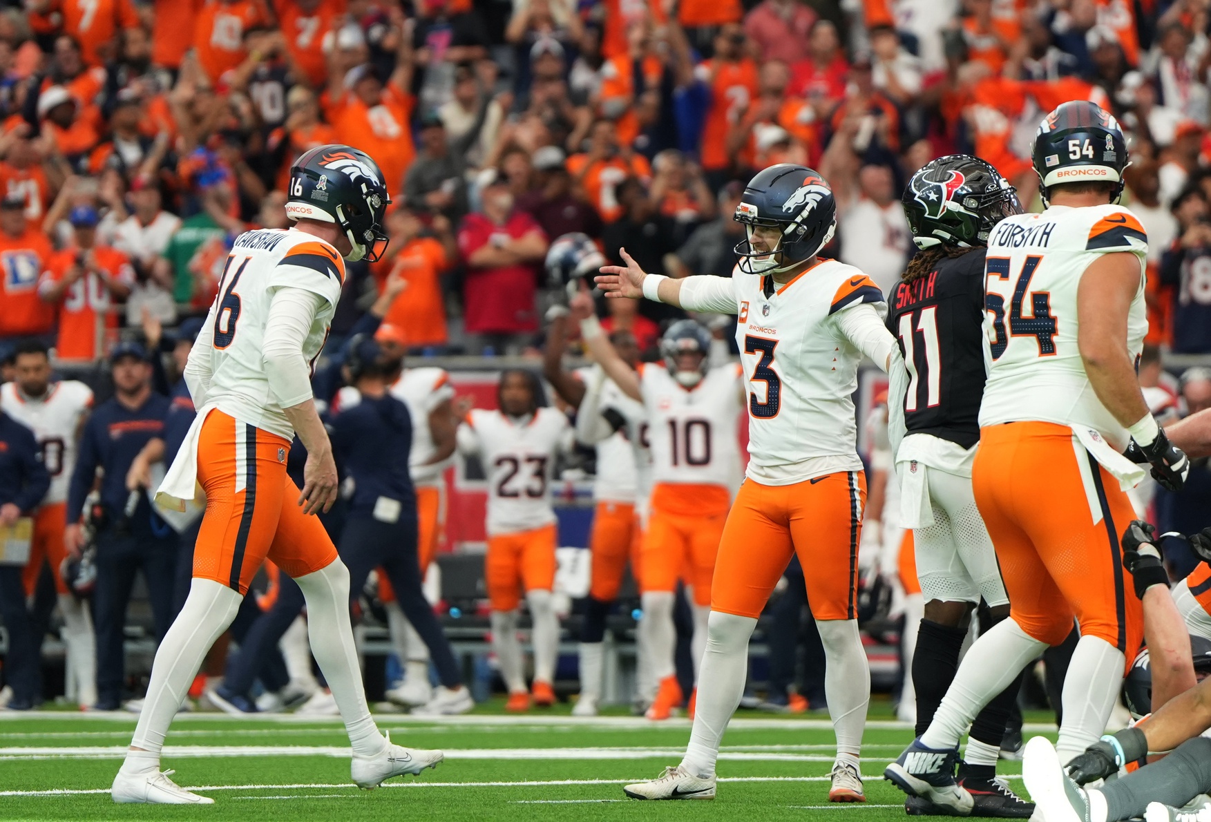 Nov 2, 2025; Houston, Texas, USA; Denver Broncos place kicker Wil Lutz (3) celebrates with punter Jeremy Crawshaw (16) after kicking a game-winning field goal during the fourth quarter against the Houston Texans at NRG Stadium.