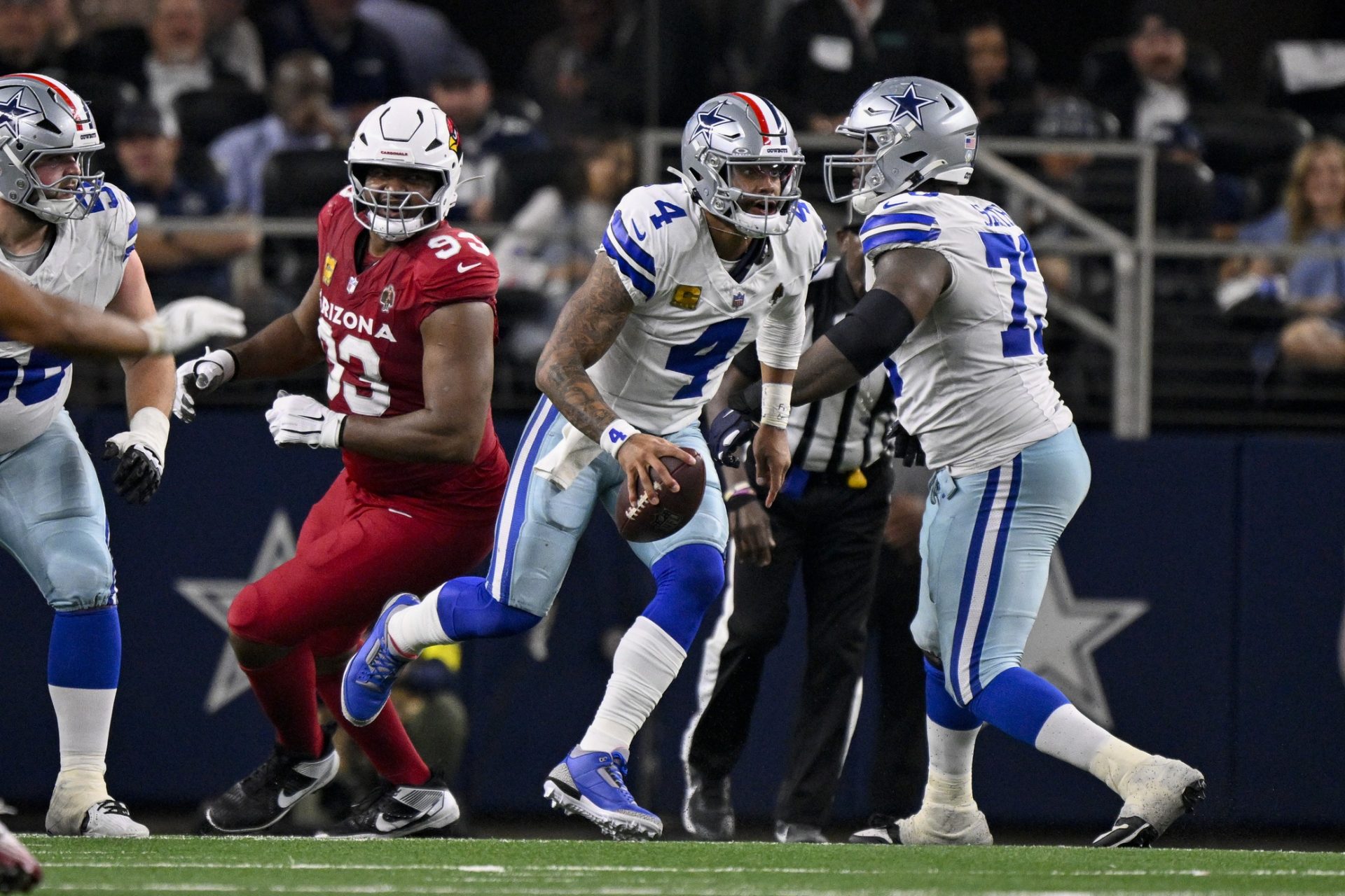 Nov 3, 2025; Arlington, Texas, USA; Dallas Cowboys quarterback Dak Prescott (4) runs with the ball during the game between the Dallas Cowboys and the Arizona Cardinals at AT&T Stadium. Mandatory Credit: