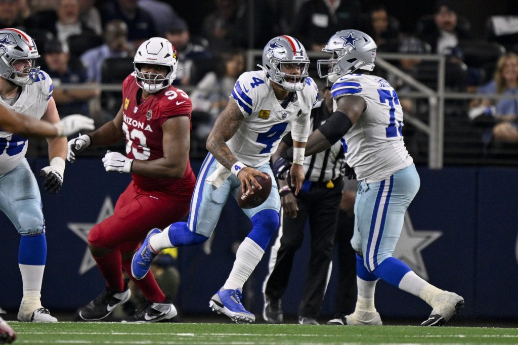 Nov 3, 2025; Arlington, Texas, USA; Dallas Cowboys quarterback Dak Prescott (4) runs with the ball during the game between the Dallas Cowboys and the Arizona Cardinals at AT&T Stadium. Mandatory Credit:
