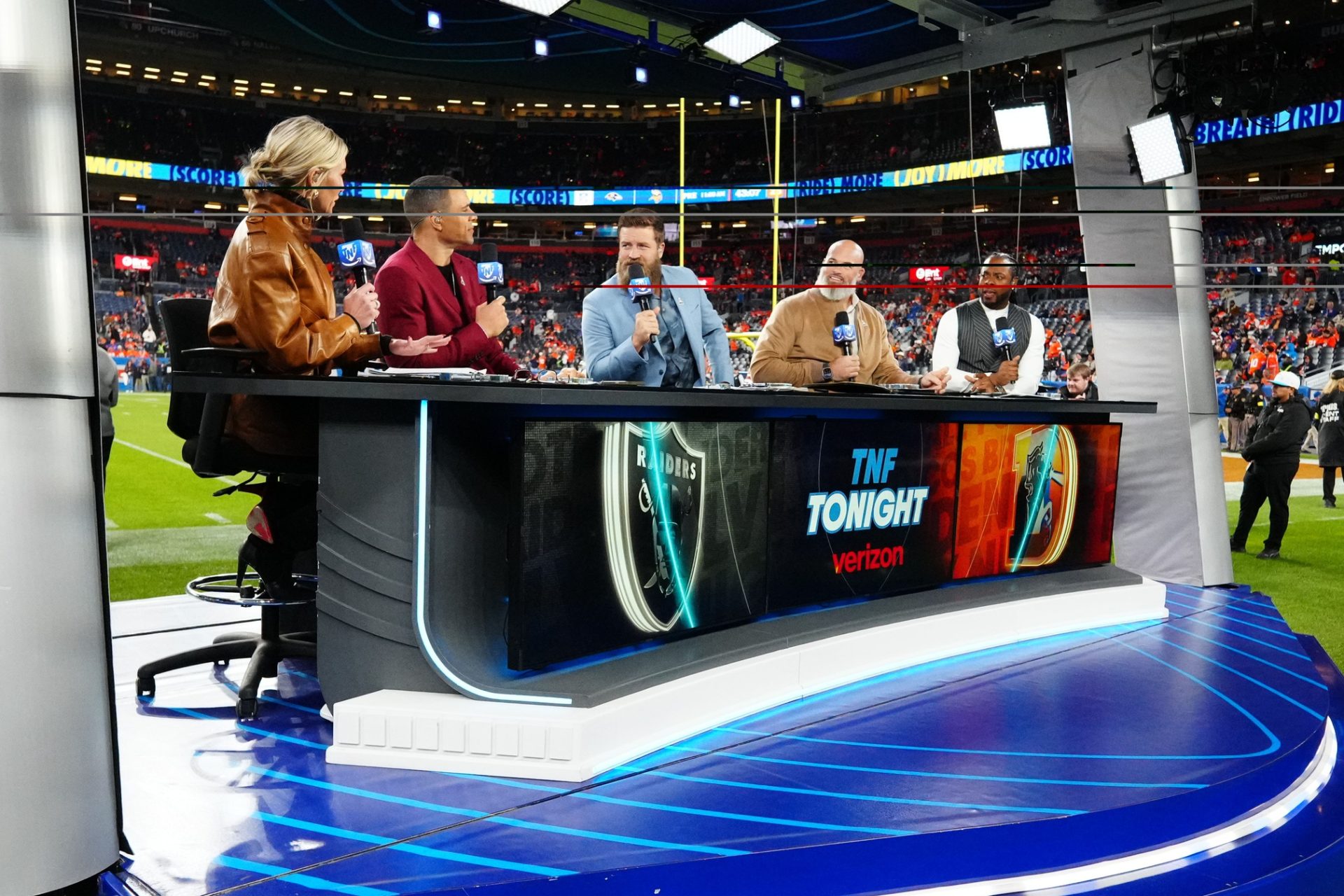 Nov 6, 2025; Denver, Colorado, USA; The Thursday night football broadcast crew before the game at Empower Field at Mile High.