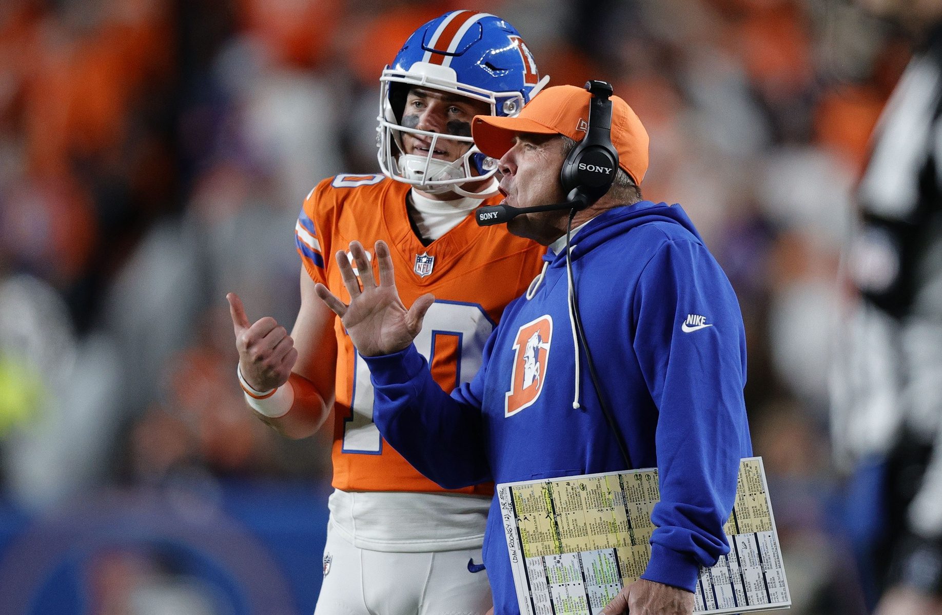 Nov 6, 2025; Denver, Colorado, USA; Denver Broncos head coach Sean Payton talks with quarterback Bo Nix (10) during the second half at Empower Field at Mile High.