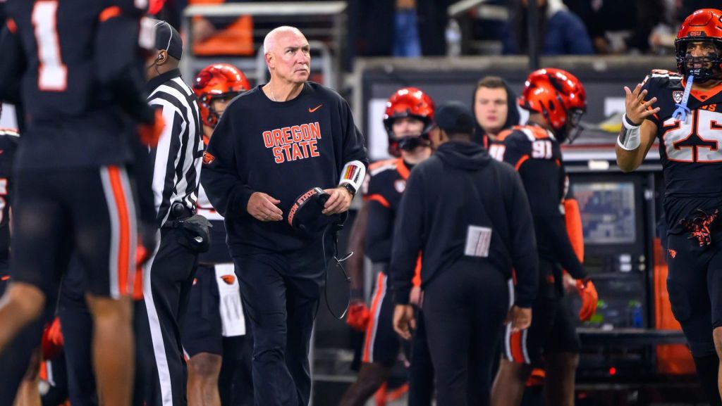 Nov 8, 2025; Corvallis, Oregon, USA; Oregon State Beavers interim head coach Robb Akey check the scoreboard during the second quarter against the Sam Houston Bearkats at Reser Stadium.